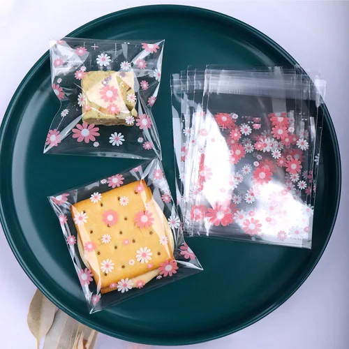 Vista 8 de 100 bolsas de galletas de margaritas blancas y rosadas, bolsas de dulces autosellantes para golosinas, galletas, postres, bonitas bolsas de celofán