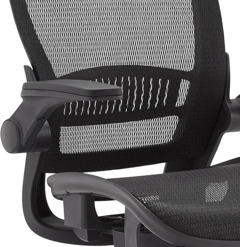 Vista 4 de Amazon Basics Silla ergonómica de escritorio con respaldo alto, cómodos reposabrazos abatibles, asiento de malla contorneada, giratorio, negro, 25.5